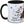 Schwarze Tasse mit Cherryhead-Design, von TK Tassen, mit buntem Tiermotiv auf weißem Hintergrund.